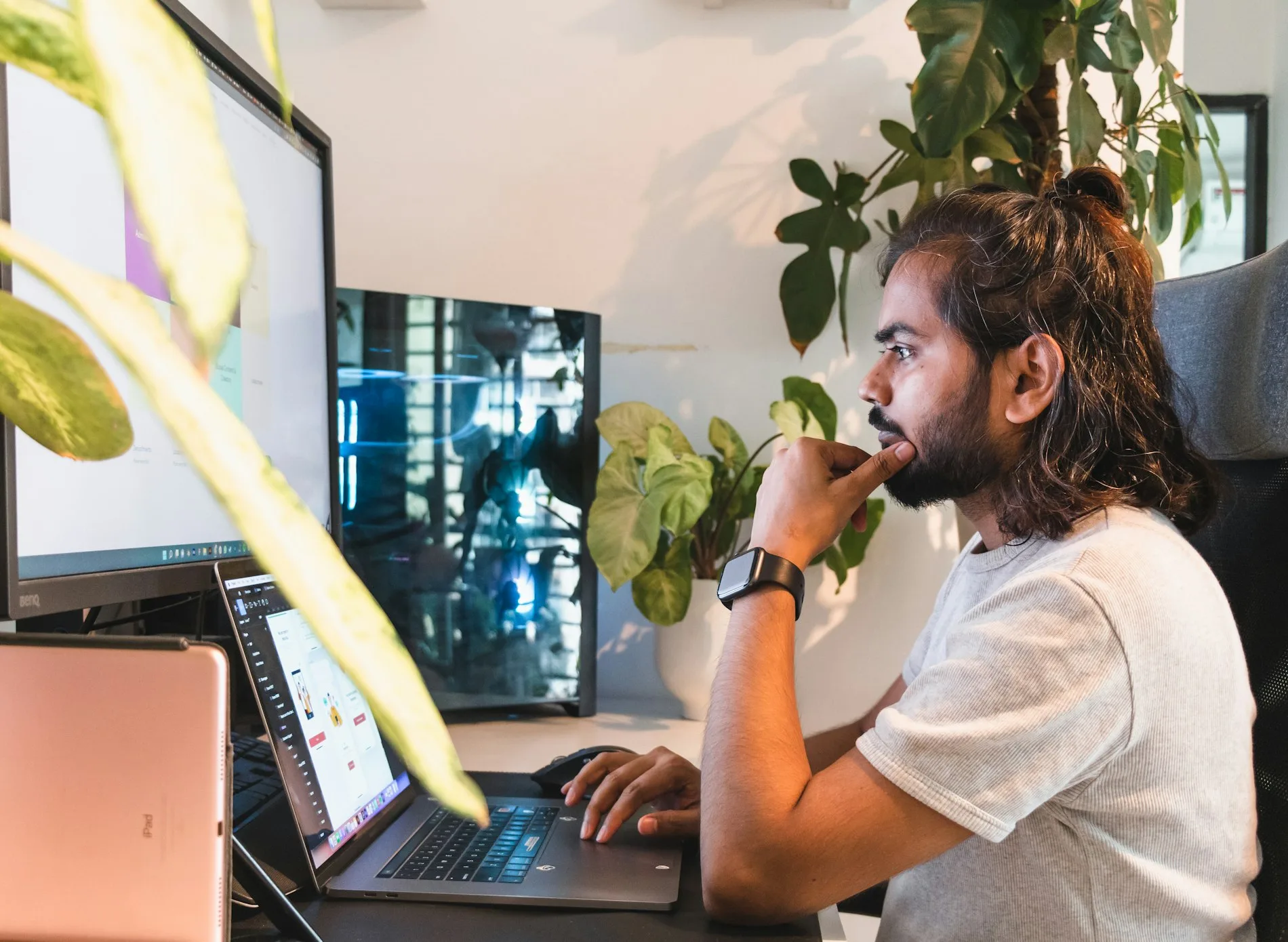 A nearshore developer in Mexico works at a laptop.