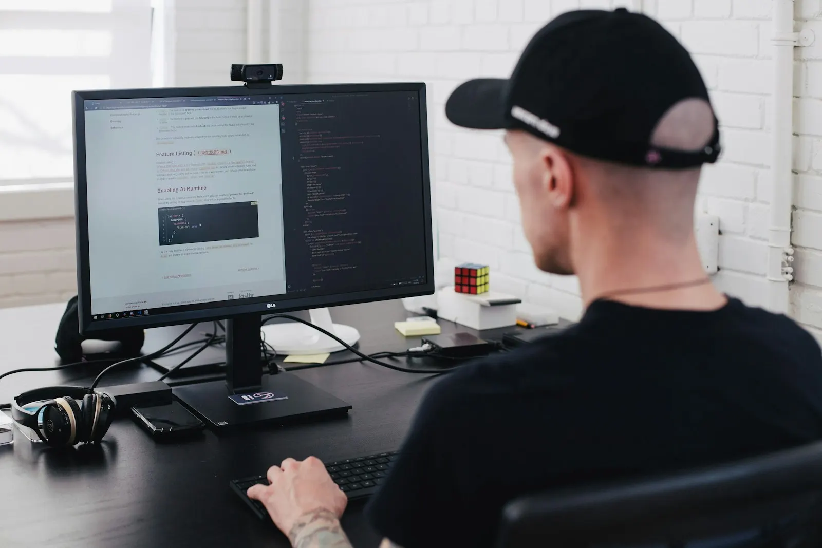 A nearshore full-stack developer in Canada works at a monitor in a bright studio.