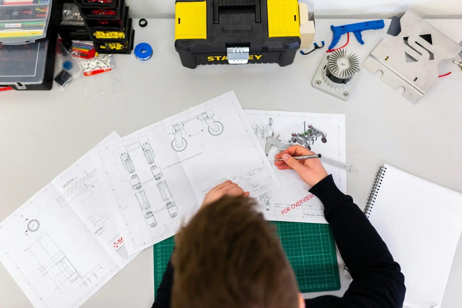A product specialist developer building an interface on a large monitor.